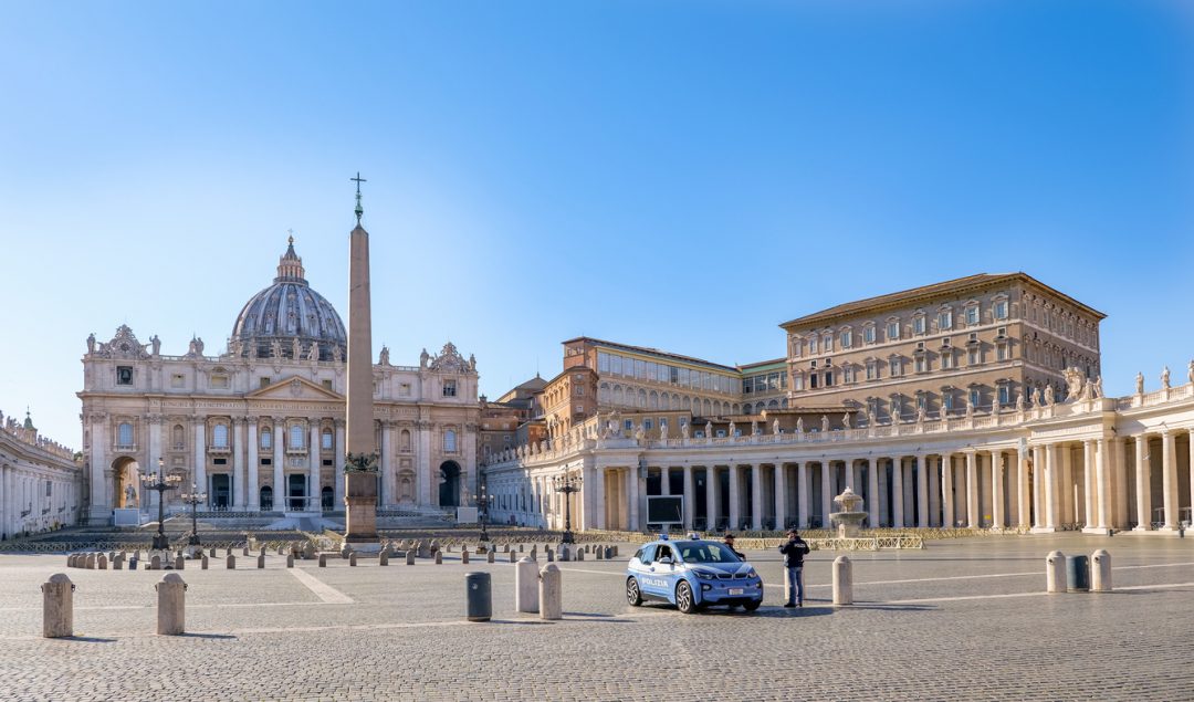 An Italian police patrol checks the Piazza of St. Peter's Basilica completely deserted