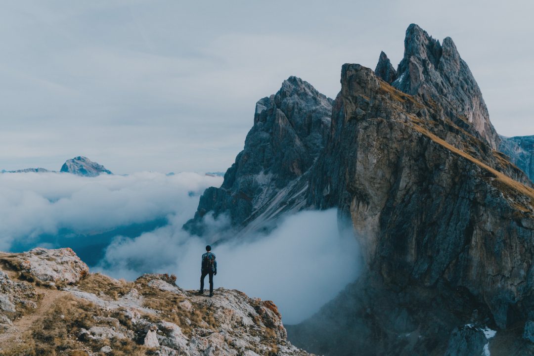 Man hiking near Seceda mountain in Dolomites