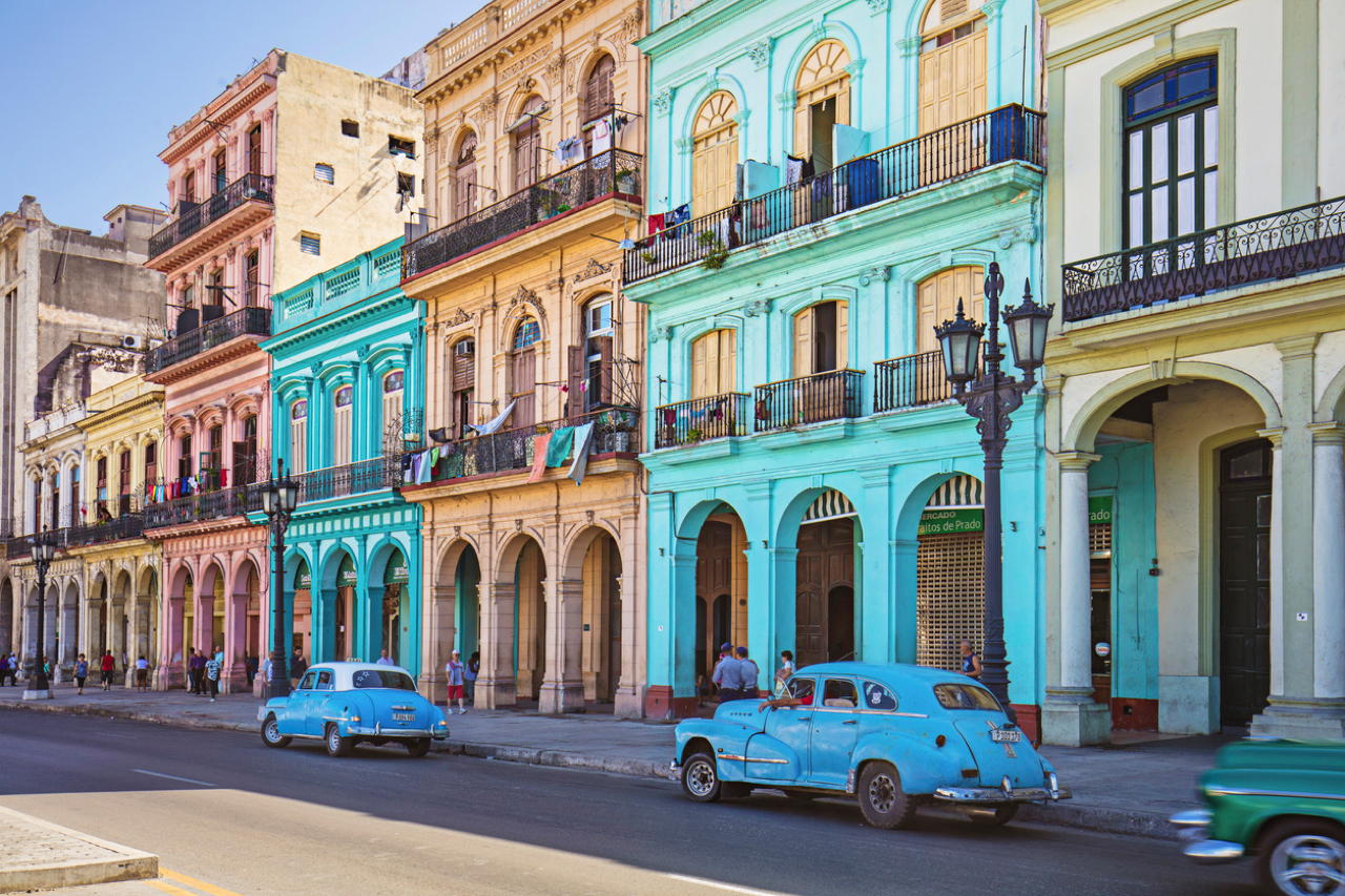 Vintage taxis and historic buildings in Cuba's capital